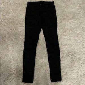 Distressed black skinny jeans. Flying monkey.